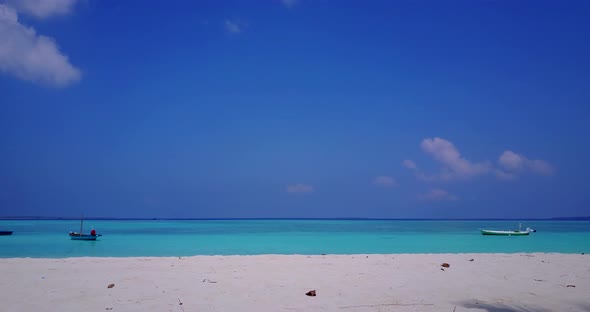 Daytime overhead copy space shot of a sandy white paradise beach and blue ocean background in best q