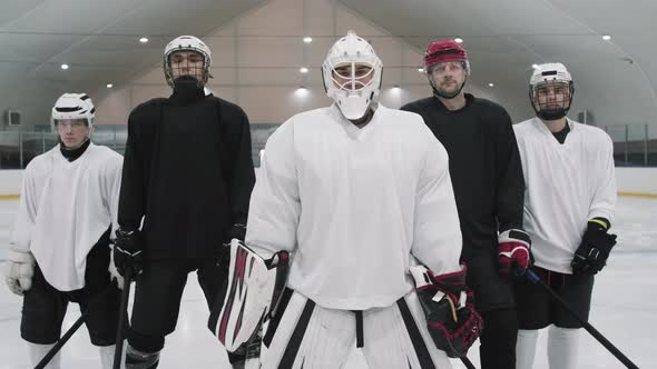 Portrait Of Male Hockey Players In Helmets