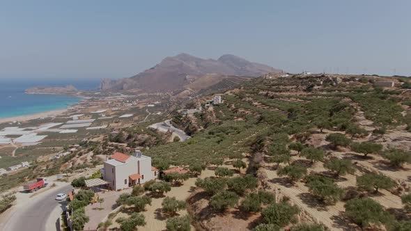 Road with magical view to Falasarna beach in Crete island, aerial drone view