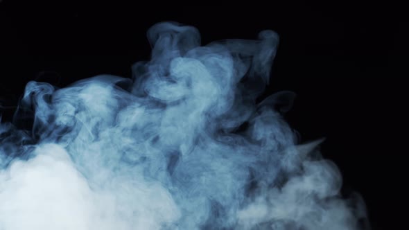 Smoke texture over blank black background. Mystical steam at night.