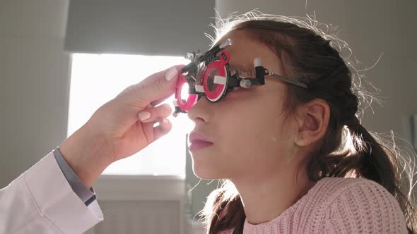 Little Girl Wearing Trial Frame Testing Vision