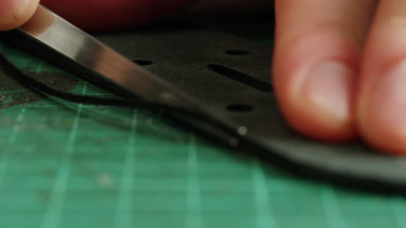 Man Tailor Cutting Artificial Leather Closeup