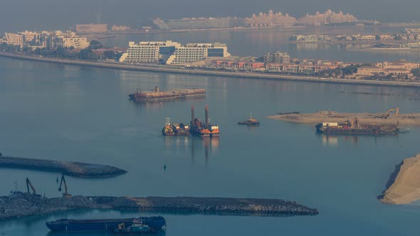 A Breathtaking Aerial View of the Palm Jumeirah During Sunrise Timelapse From a Rooftop Dubai United