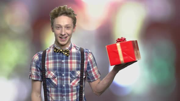 Teenage Guy Showing Beautiful Gift Box