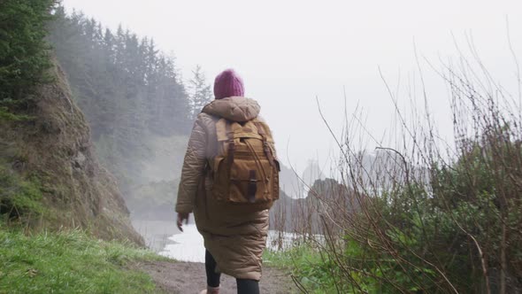 Slow Motion Woman Enjoying Breathtaking View on Rainy Day Staying at Sea Rock