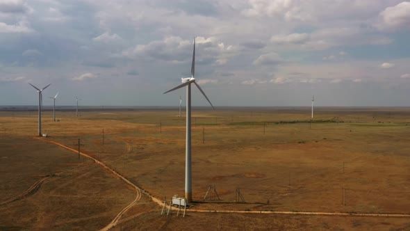 wind farm in the field, cloudy weather