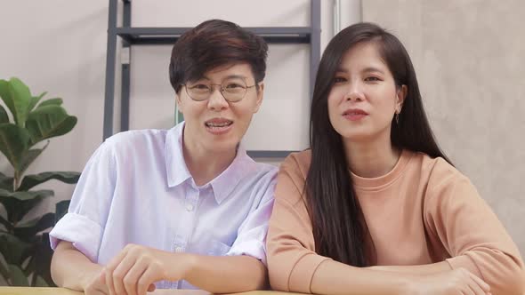 Asian LGBT couples live together at home.