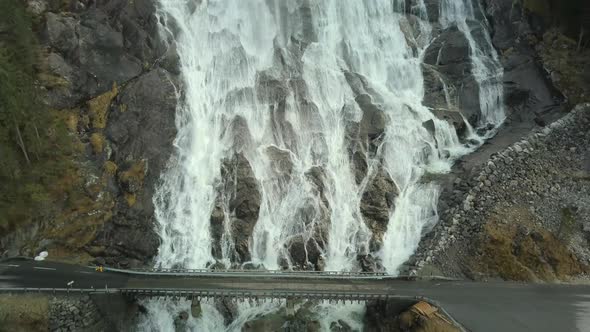 Close Up Pull Back Shot of the Famous Furebergfossen Waterfall in Norway, Aerial View