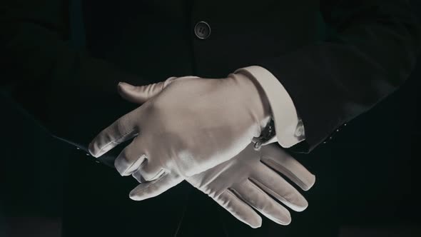 Hands of a Magician Who Pulls a Smartphone Out of His Sleeve