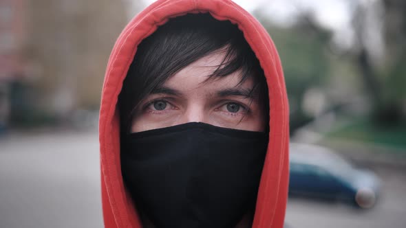 Closeup Portrait of Young Man in Protective Mask Standing Outdoors Seasonal Flu Epidemic in Country