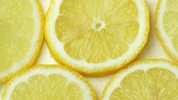 Rotation of a juicy yellow lemon. Top view, 360 degree rotation, close-up of a lemon in a cut.