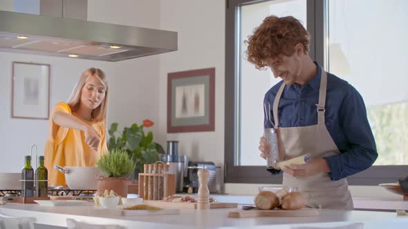 Young Couple Cooking Together for Lunch and Preparing Food Spaghetti Pasta Carbonara