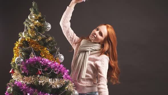 Redhead Girl Dancing in Christmas Party