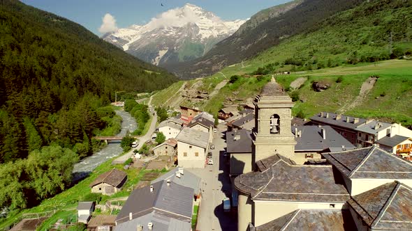 Aerial view of Lanslebourg village and snow peak mountain, Savoie, France.