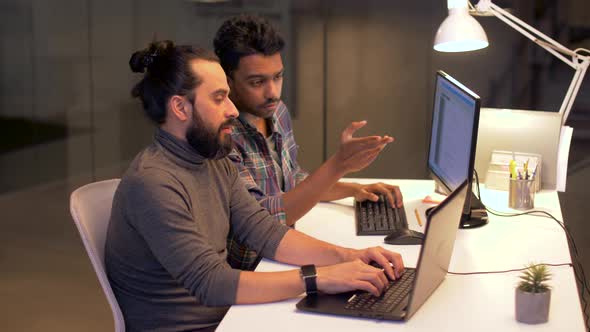 Programmers with Computers Working Late at Office 22