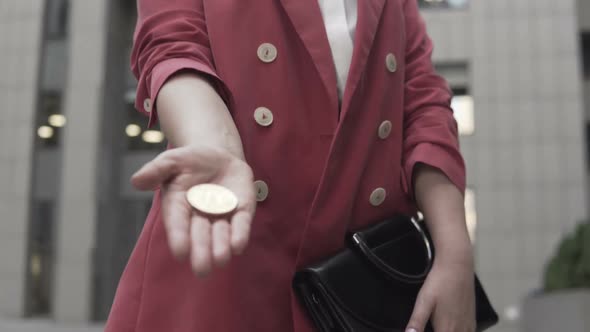 Business Woman With Bitcoin in Her Hands