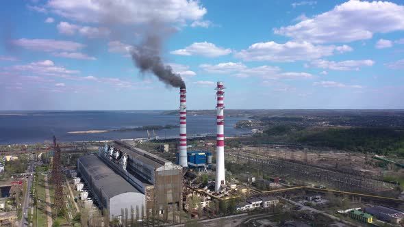 Coal-fired Smokestack Releasing Black Smoke into the air. Environmental pollution 4K aerial