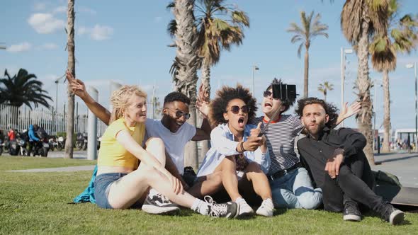 Laughing Friends Taking Selfie on Meadow