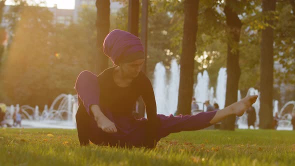 Strong Islamic Muslim Indian Woman in Hijab Active Girl Doing Yoga in Park Outdoors Training