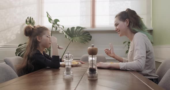 Children Two Girls Eat Lunch Sitting at Table in Home Kitchen, Homemade Food