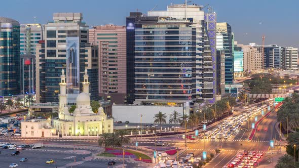 Mosque Near Dubai Creek Surrounded By Modern Buildings and Busy Traffic Street Day to Night