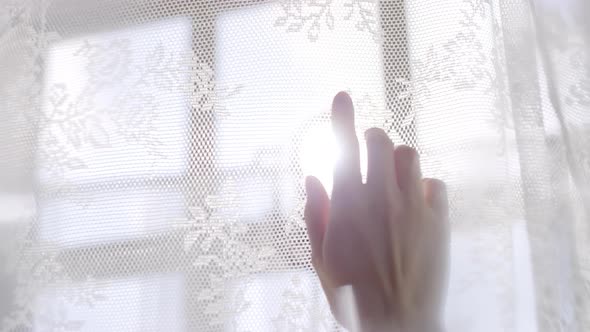 Slowmo of Female Hand Touching Lace Curtains on Sunny Morning