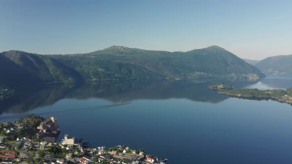 Fjord Sørfjorden between Osterøy and Vaksdal with passing boat in between- Aerial overview