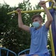 A teenage boy in a medical mask is engaged in sports - VideoHive Item for Sale