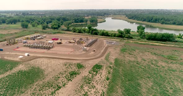 This shot shows proximity of a petroleum depot next to delicate ecosystem.  The Poudre River.  drone