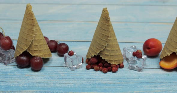 Berry and Fruit Ice Cream. Apricot, Strawberry, Cherry in a Waffle Cone