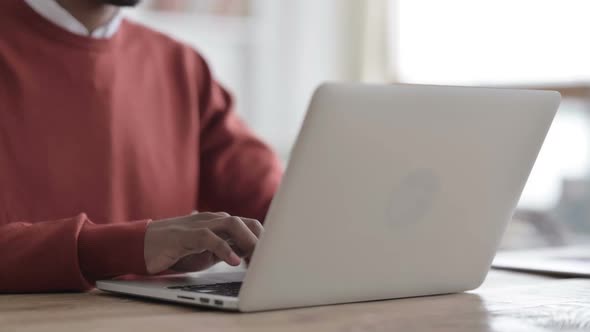 Hands Close up of African Man Typing on Laptop