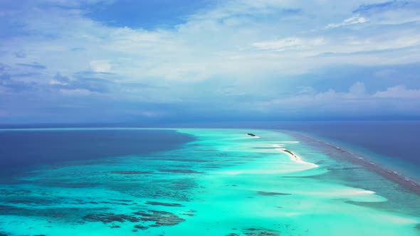 Natural flying abstract view of a sunshine white sandy paradise beach and aqua blue ocean background
