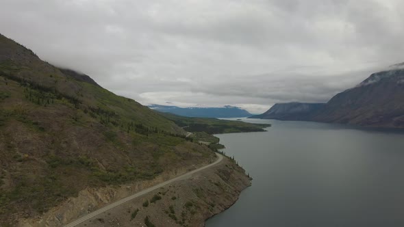 Beautiful View of Scenic Road Alongside Peaceful Lake