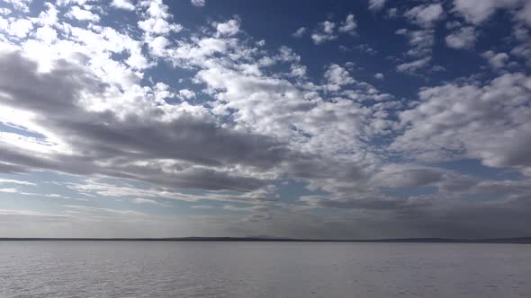 Bright Neat Cloud Fragments Above the Lake