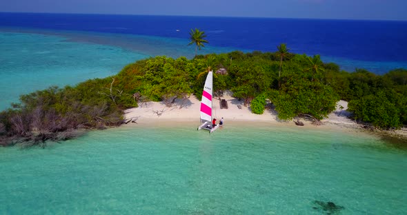 Wide above clean view of a sunshine white sandy paradise beach and aqua turquoise water background i