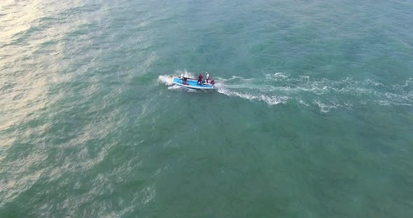 Aerial view of traditional fishing boat driving in the sea of Rio do Fogo.