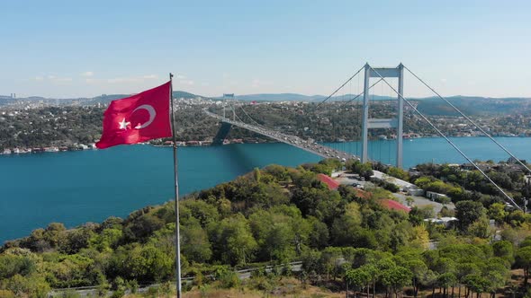 Aerial view of Fatih Sultan Mehmet Bridge and Turkish Flag