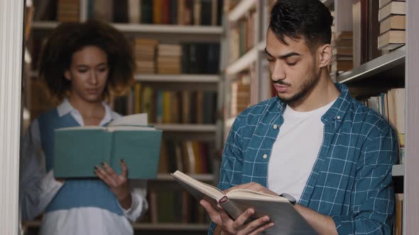 Students Classmates Read Books in University Library Young Guy and Girl Study Topic Do School Work