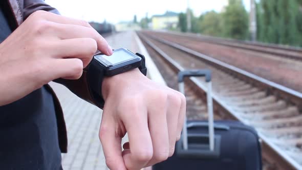 Woman Using Smart Watches At The Station