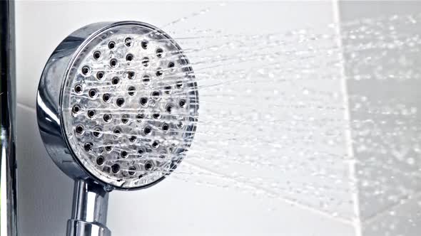 A Stream of Water Pours From the Shower Head