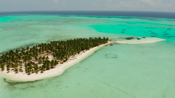 Tropical Island with a Beach on the Atoll. Onok Island Balabac, Philippines.