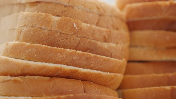 Toast bread slices pile of organic wheat and grain 4K 2160p 30fps UHD footage - Tasty fresh bread fo