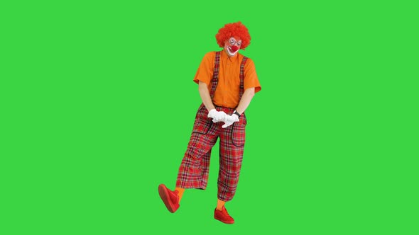 Male Clown Yawning Stitching and Doing Some Exercise in the Morning on a Green Screen Chroma Key