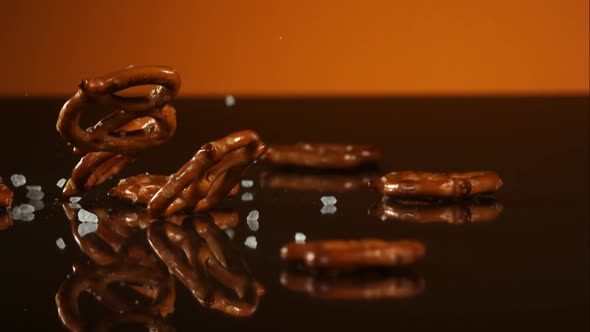 Pretzels falling and bouncing in ultra slow mo 