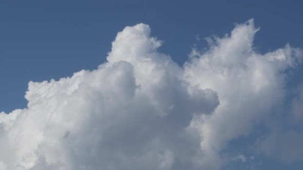 Clouds Avanzing in the Blue Sky