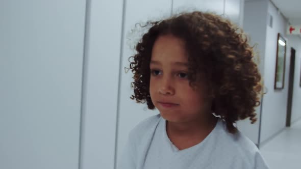 Close-up of African american disabled boy walking in corridor at hospital 