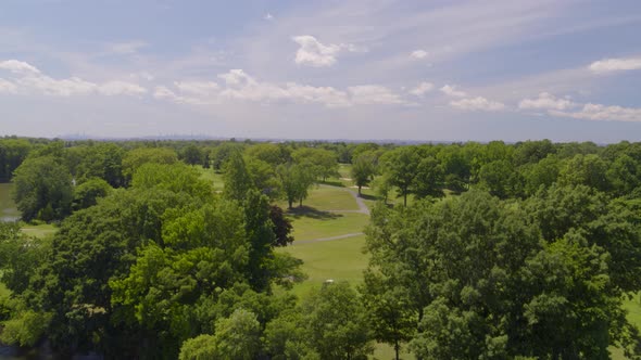 Rising Aerial Pan of a Golf Course in a Long Island Village