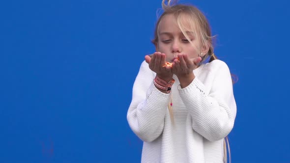 Happy Girl Blowing Confetti