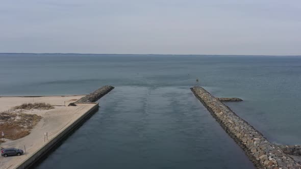 An aerial view over the Shinnecock Canal in Hampton Bays, Long Island, NY. The drone camera dolly in