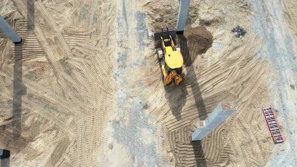Top View of an Excavator Operating at a Construction Site
